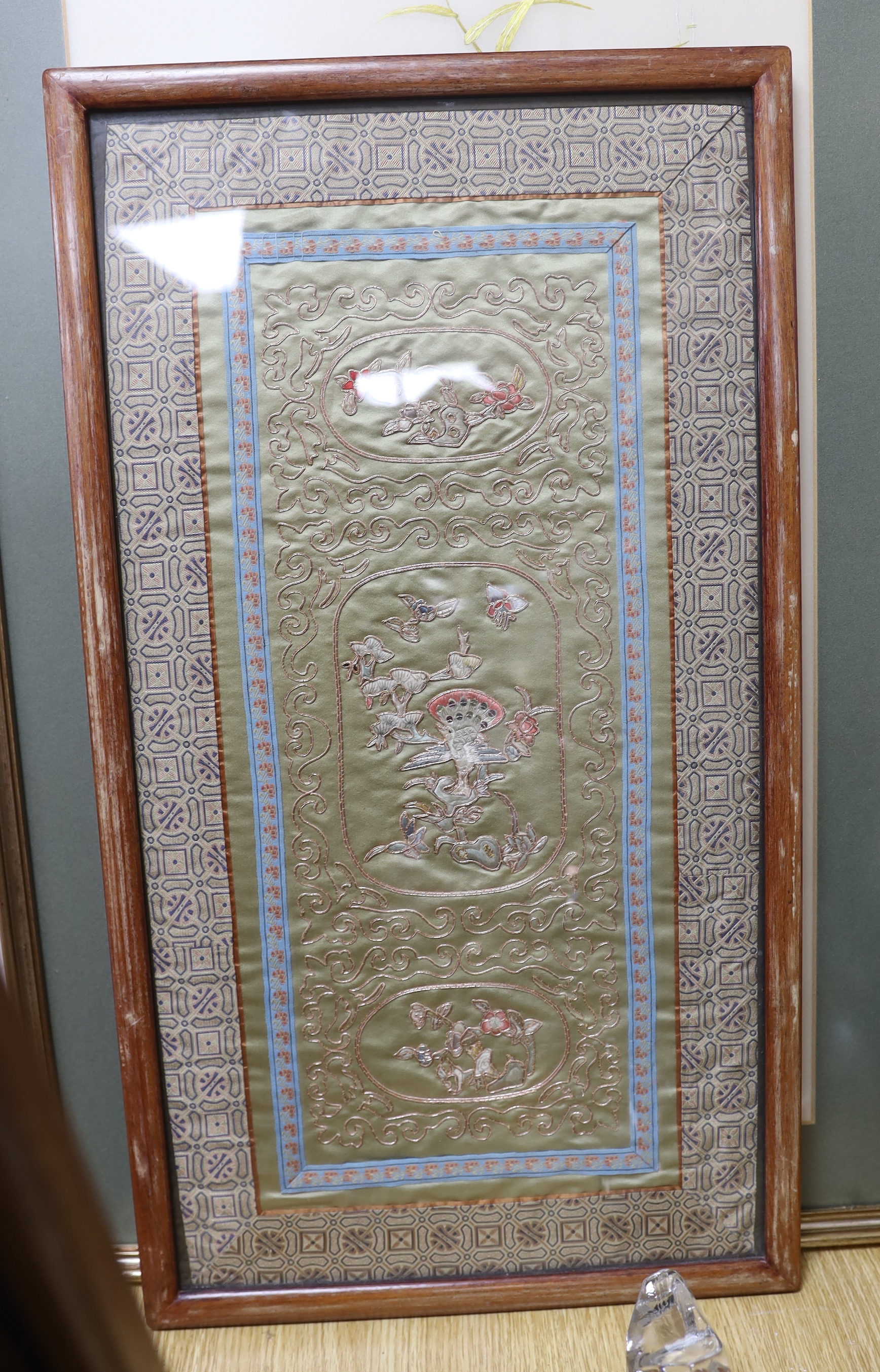 Four Chinese silk embroidered pictures including birds of paradise and a calligraphy scroll (each framed), largest 62cm x 36